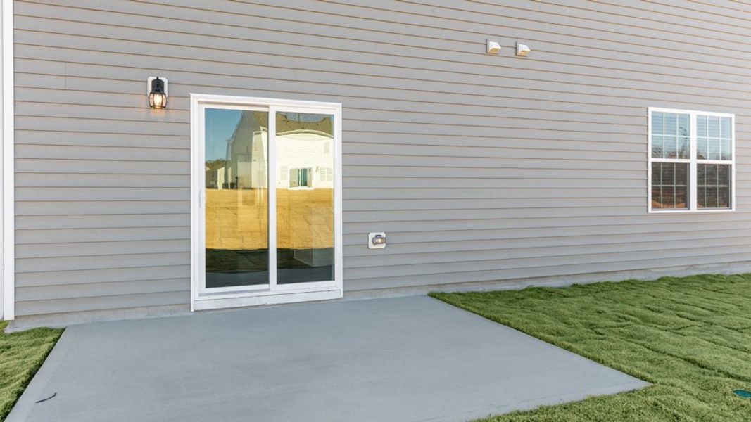 Exterior details and patio area of a home in Ridgewood Farms, Winterville (Image 4).
