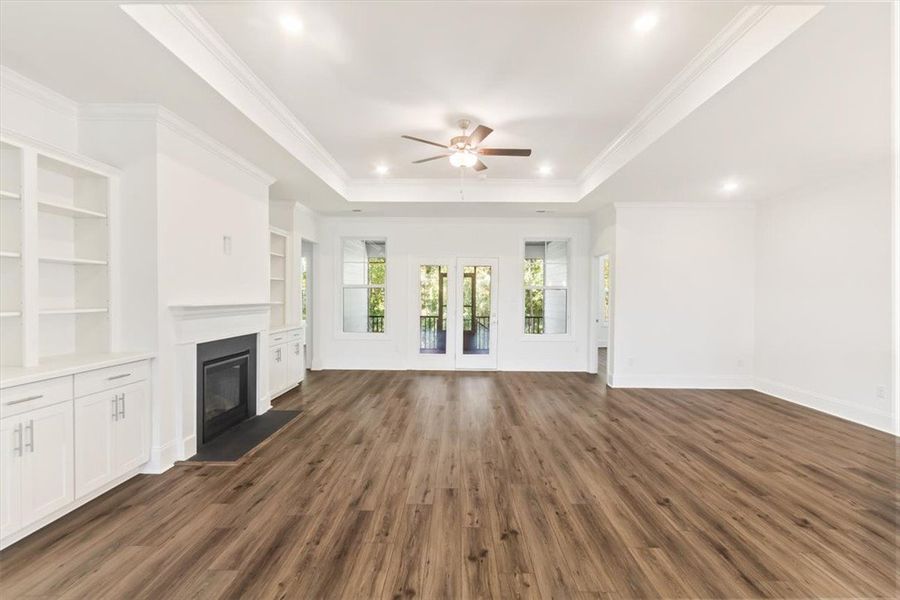 Gleaming LVP floors flow throughout a versatile li