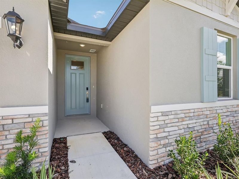 Exterior details and patio area of a home in The Grove at Stuart Crossing - Classic Series, Bartow (Image 18). Exterior details and patio area of a home in The Grove at Stuart Crossing - Classic Series, Bartow (Image 18).
