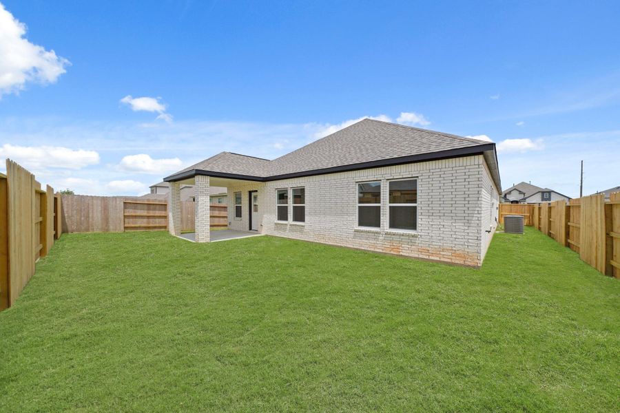 Exterior details and patio area of a home in Sunterra, Katy (Image 3).