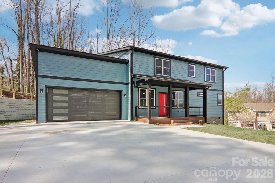 Front exterior of a new home in , Hendersonville, NC, highlighting curb appeal (Image 24).