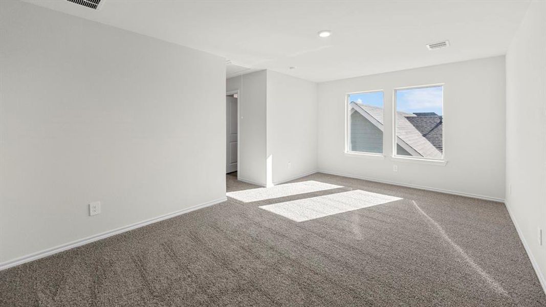 Spare room with carpet flooring and baseboards