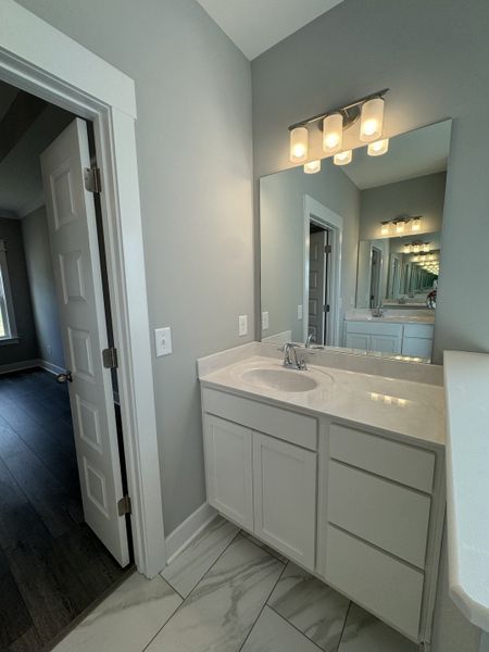 Primary bathroom features 2 separate vanities.

*Photo is from a previous listing displaying the completed floor plan some options and selections may vary from actual home.