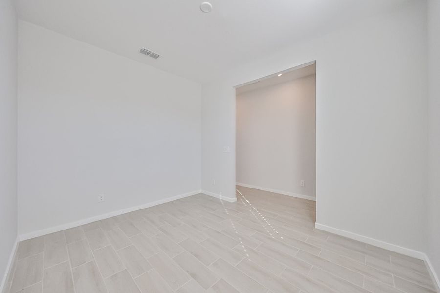 A hallway with white walls. A hallway with white walls.