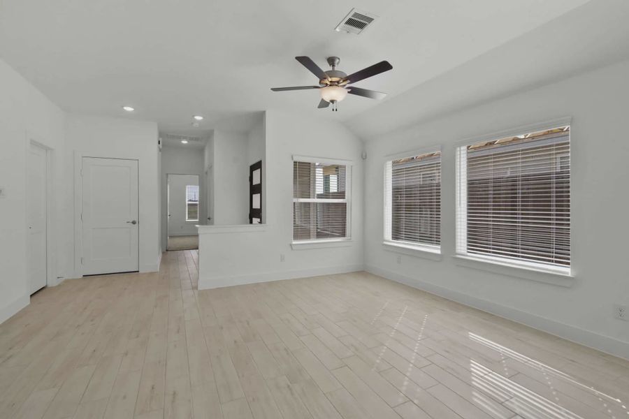 Representative unfurnished interior of a home built from the Chalet by Chesmar Homes in Meridiana Townhomes, Iowa Colony (Image 18).