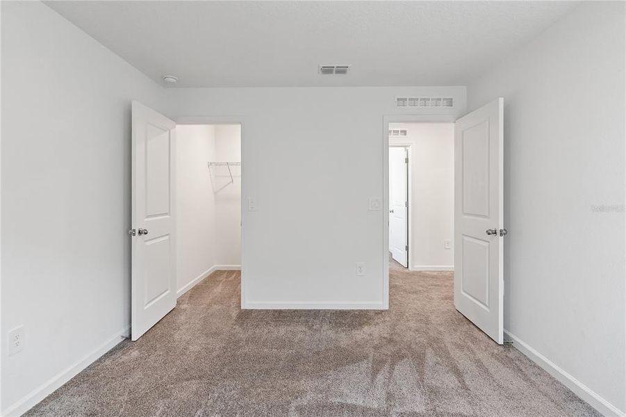 Spacious, unfurnished interior of a new home in Storey Creek: Manor Collection, Kissimmee (Image 19).