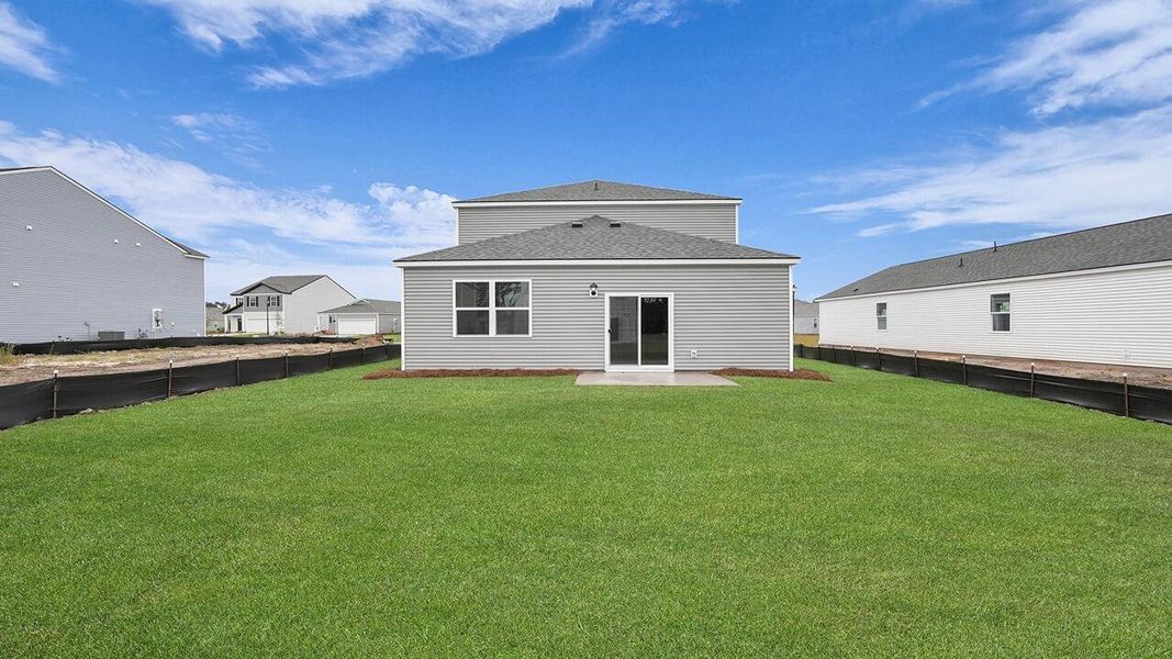 Exterior details and patio area of a home in Pine Hills at Cane Bay, Summerville (Image 22).