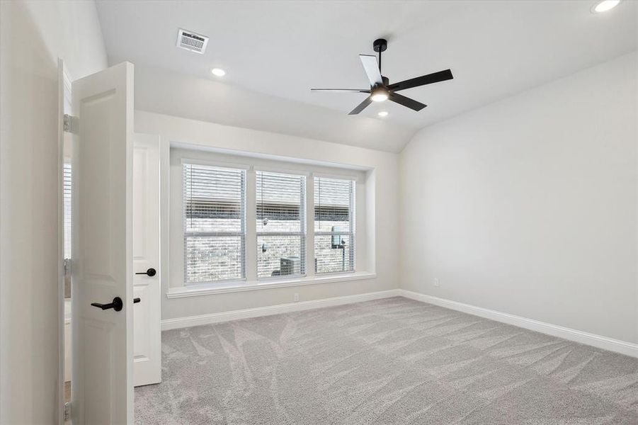 Unfurnished room featuring a ceiling fan, carpet flooring, baseboards, recessed lighting, and vaulted ceiling