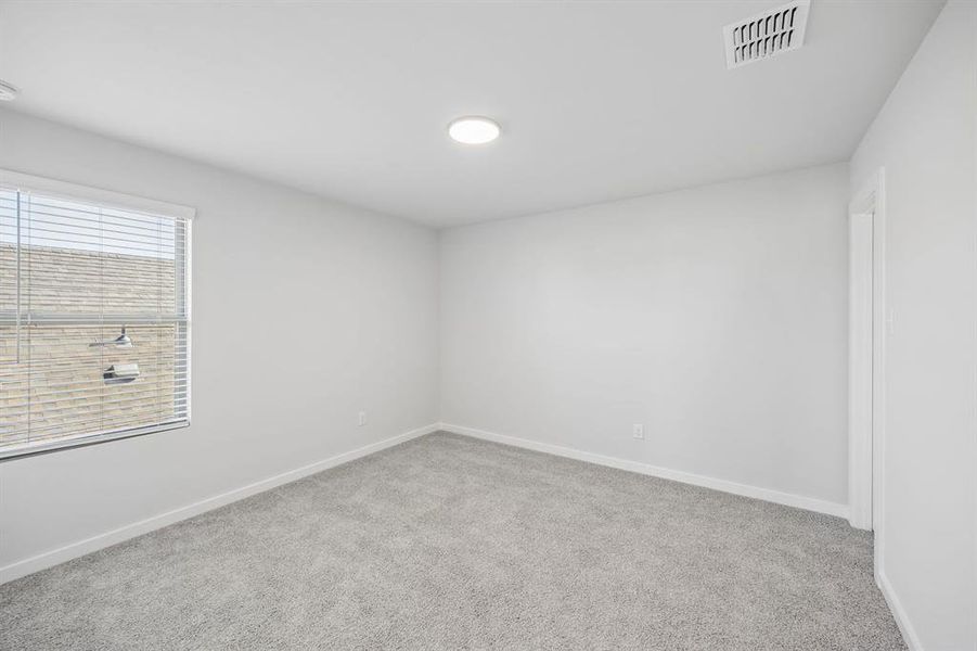 Bedroom in the Mesquite home plan by Trophy Signature Homes – REPRESENTATIVE PHOTO