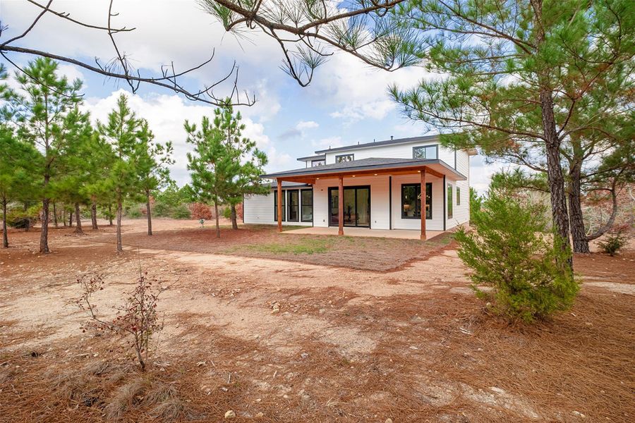 Rear view of property featuring a patio