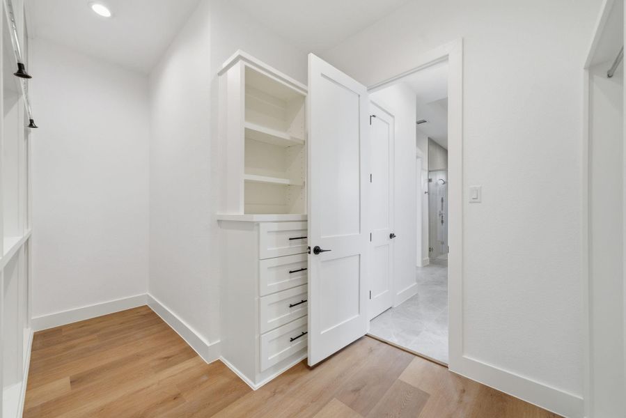 Spacious walk-in closet. Spacious walk-in closet.