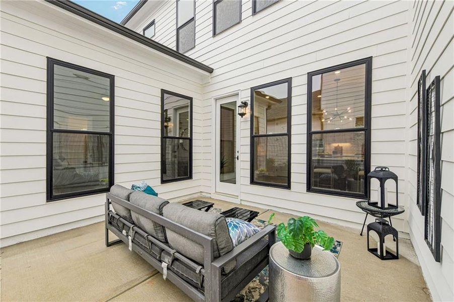 Exterior details and patio area of a home in Promenade at Sawnee Village, Cumming (Image 28).