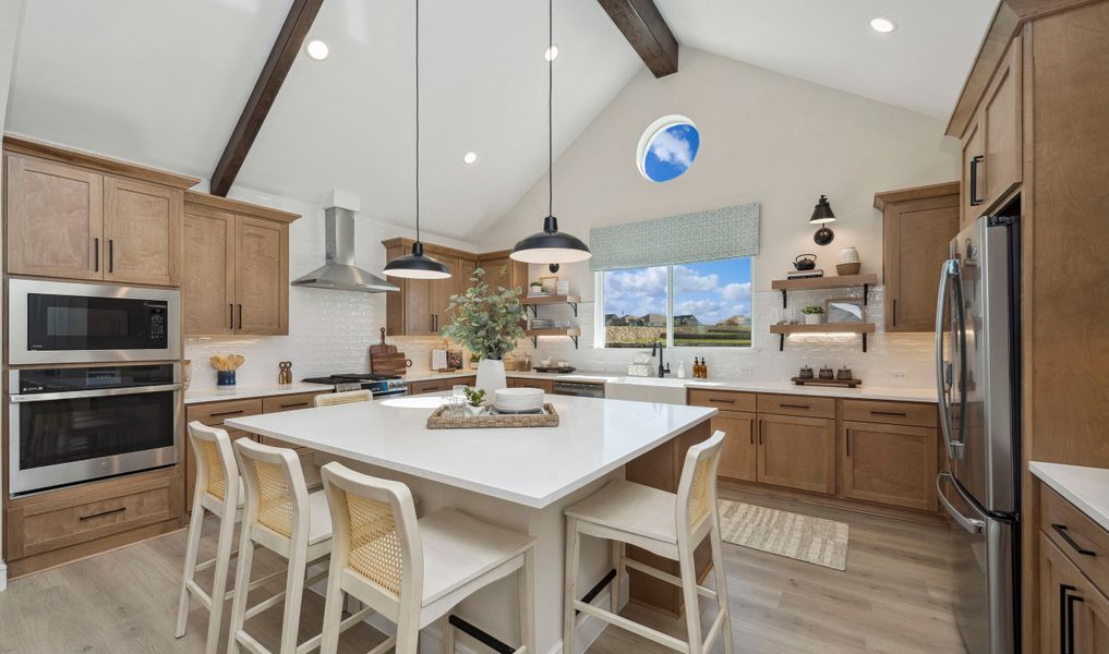 Kitchen with pendant lighting and stained ceiling beams