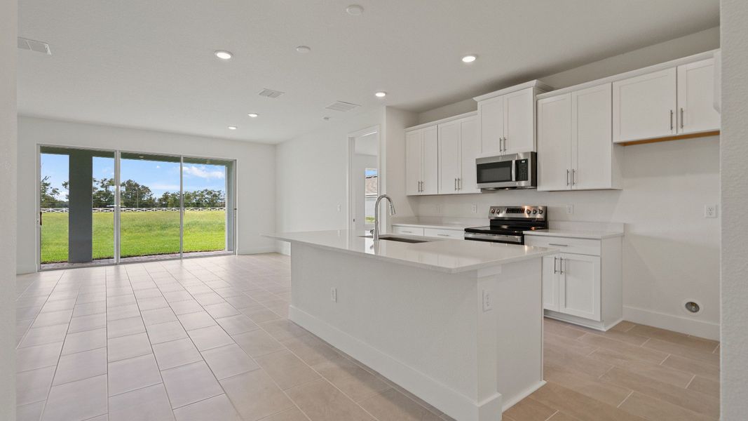 Kitchen in the Buttonwood floorplan by DRB Homes at Lakeside at Satilla in Saint Cloud, FL