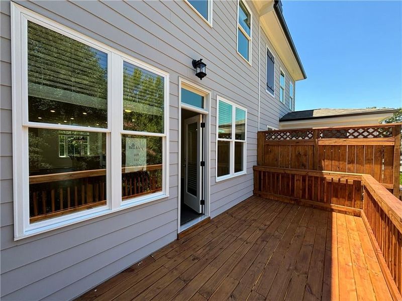 Back deck off of the family room provided privacy and entertaining room.  Or just soak up the sun and relax!