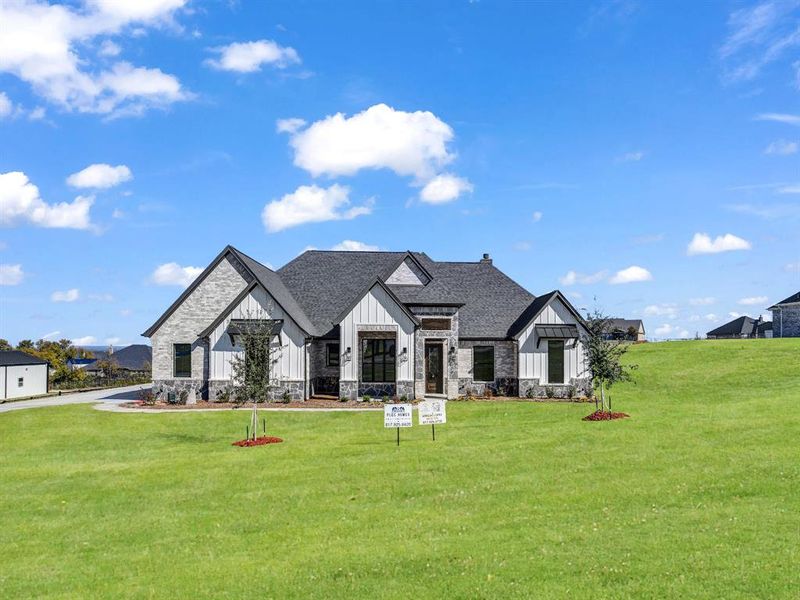 Front exterior of a new home in , Weatherford, TX, highlighting curb appeal (Image 2).