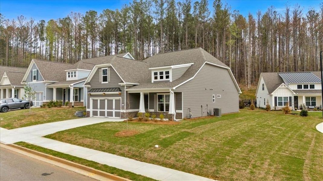 Front exterior of a new home in Stratford at NatureWalk, Dallas, GA, highlighting curb appeal (Image 27).