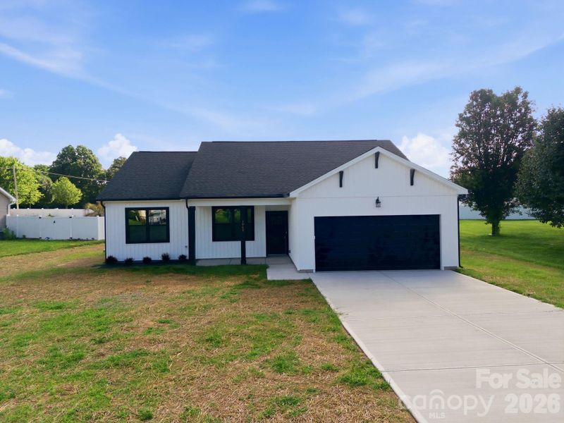 Front exterior of a new home in , Oakboro, NC, highlighting curb appeal (Image 21). Front exterior of a new home in , Oakboro, NC, highlighting curb appeal (Image 21).