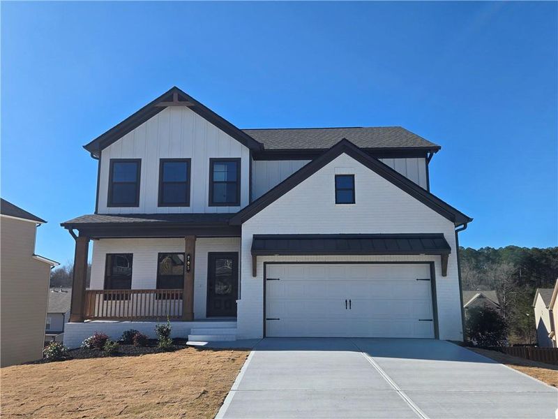 Front exterior of a new home in Enclave at Logan Point, Loganville, GA, highlighting curb appeal (Image 23).