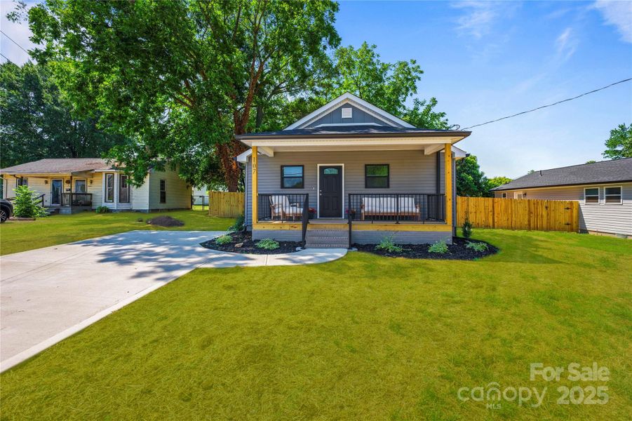 Front exterior of a new home in , Stanley, NC, highlighting curb appeal (Image 24).