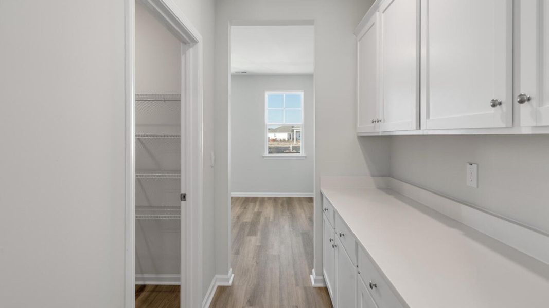 Representative unfurnished interior of a home built from the HARBOR OAK by D.R. Horton in Indigo Preserve, Leland (Image 24).