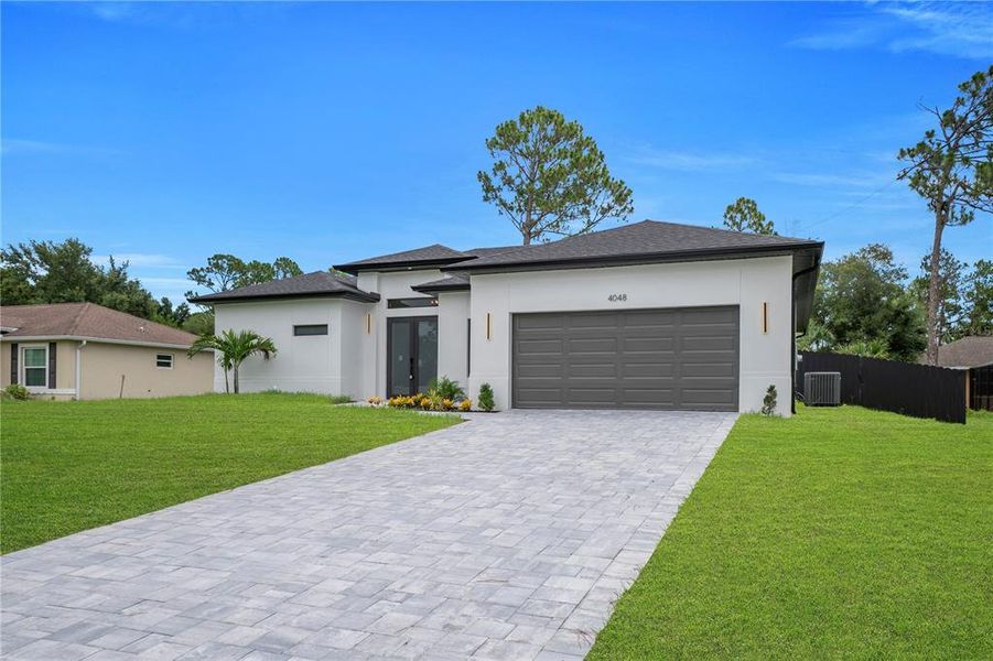 Front exterior of a new home in , North Port, FL, highlighting curb appeal (Image 20). Front exterior of a new home in , North Port, FL, highlighting curb appeal (Image 20).
