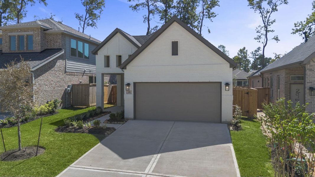 Front exterior of a new home in The Woodlands Hills, Willis, TX, highlighting curb appeal (Image 22). Front exterior of a new home in The Woodlands Hills, Willis, TX, highlighting curb appeal (Image 22).