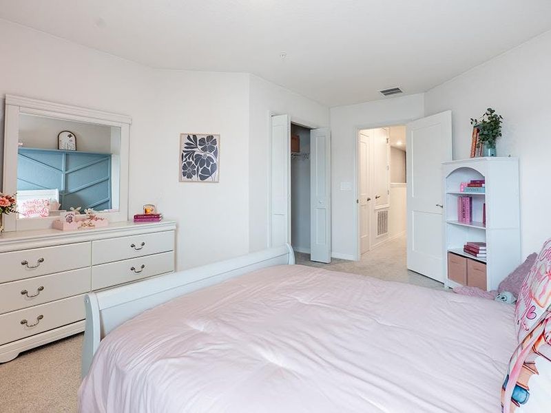 Large secondary bedrooms provide space for everyone in your household - Azalea townhome by Highland Homes