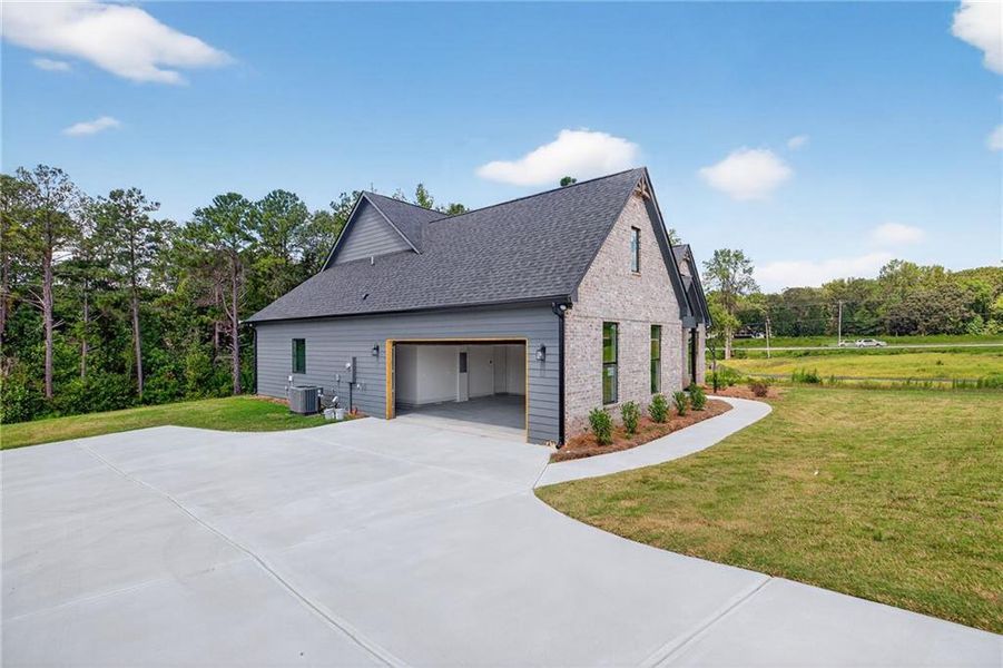 Front exterior of a new home in , Dallas, GA, highlighting curb appeal (Image 23).