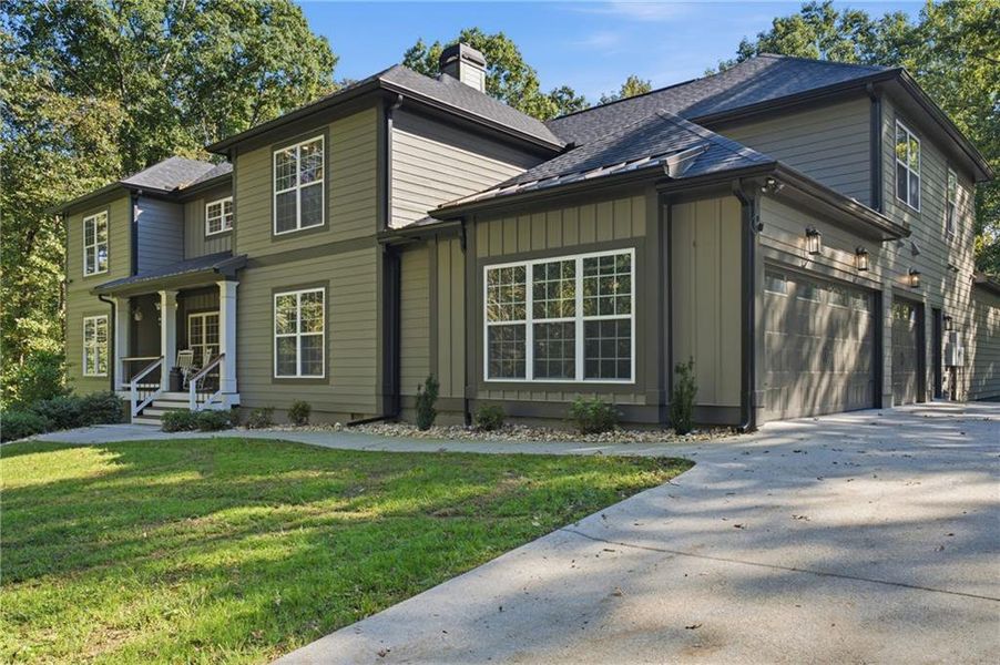Front exterior of a new home in , Auburn, GA, highlighting curb appeal (Image 27).
