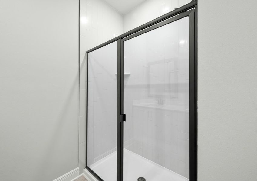 The master bathroom has a large walk-in shower