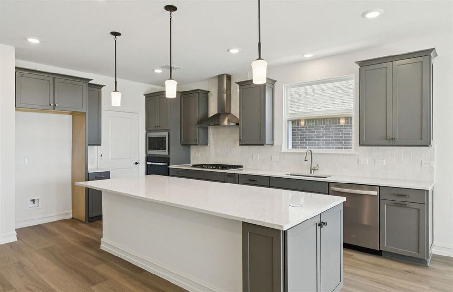 Spacious kitchen with eat-in bar top island