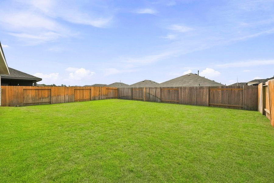 Exterior details and patio area of a home in Grand Pines, Magnolia (Image 3).