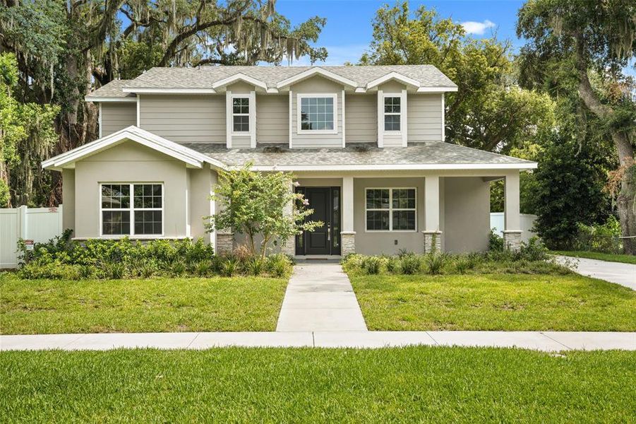 Front exterior of a new home in , Orlando, FL, highlighting curb appeal (Image 1). Front exterior of a new home in , Orlando, FL, highlighting curb appeal (Image 1).