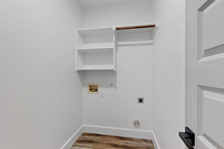 Laundry room featuring hookup for an electric dryer, dark wood-style floors, hookup for a washing machine, and gas dryer hookup