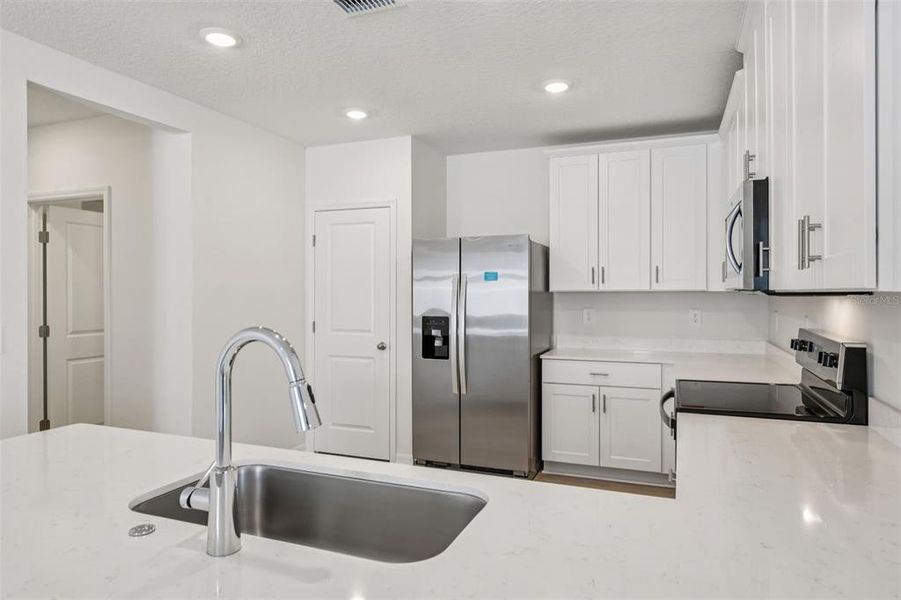 Furnished interior view inside a new home in Ridgehaven - Villas, Ormond Beach (Image 8).
