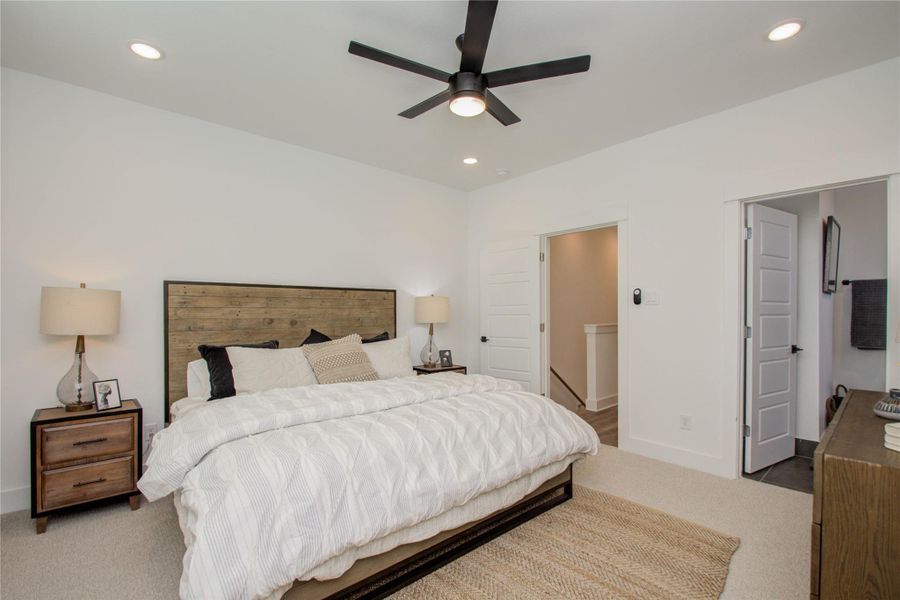 Spacious and elegant primary bedroom! Photos from another community by the same builder, FINISHES & FLOOR PLAN MAY VARY! Ceiling fans are not included!
