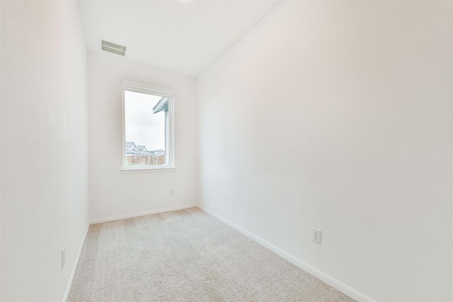 This room is perfect for a cozy office, storage space or play area located on the first floor.