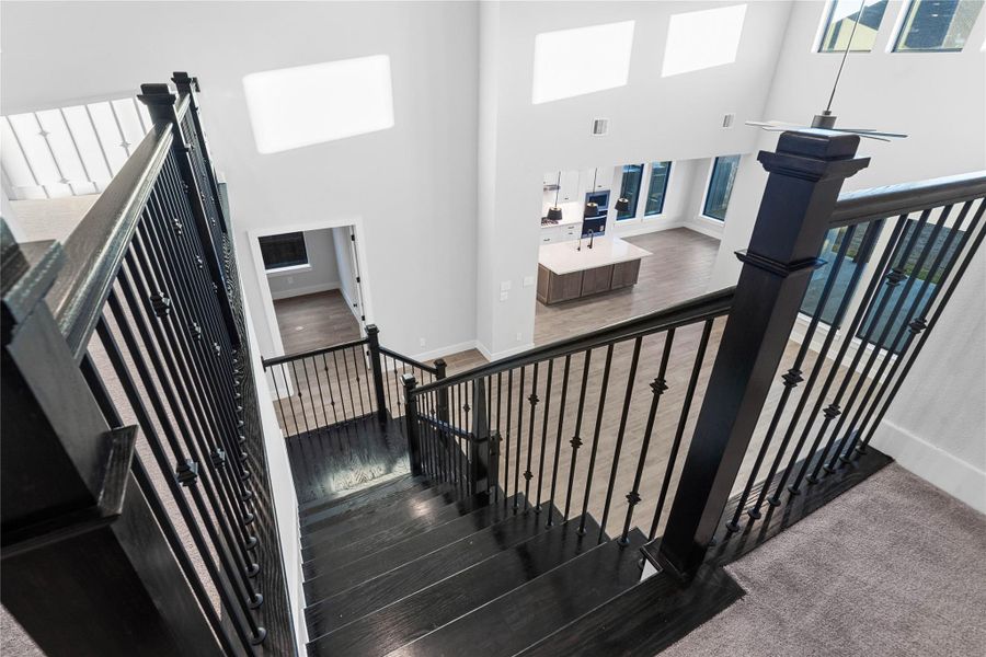 A phenomenal view from the second story, capturing the seamless flow between levels and an abundance of natural light.