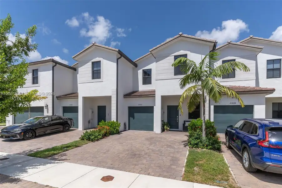 Front exterior of a new home in , Miami, FL, highlighting curb appeal (Image 1). Front exterior of a new home in , Miami, FL, highlighting curb appeal (Image 1).