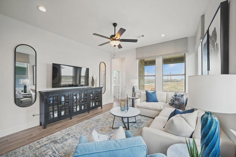 Representative furnished interior of a home built from the Athens by Chesmar Homes in Sunterra, Katy (Image 11).