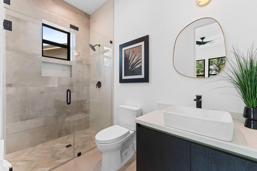Custom tilework, floating vanity, and walk-in shower bring hotel-level comfort home. Custom tilework, floating vanity, and walk-in shower bring hotel-level comfort home.