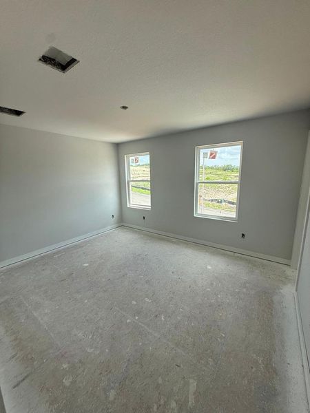 A versatile interior space awaits customization, offering views through well-placed windows. A versatile interior space awaits customization, offering views through well-placed windows.