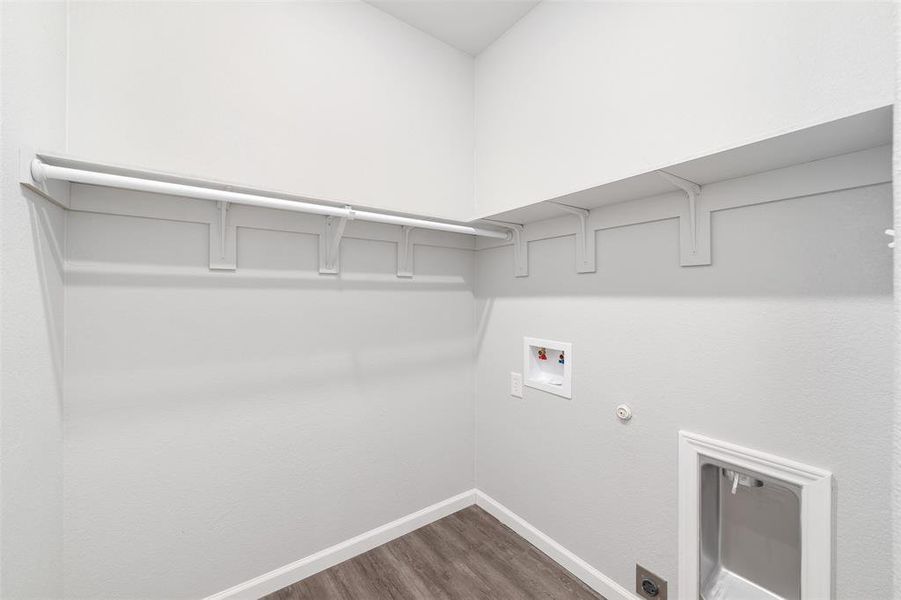 Laundry area featuring wood-type flooring, washer hookup, and hookup for a gas dryer