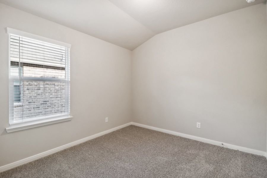 Guest bedroom in the Cascade floorplan at a Meritage Homes community.