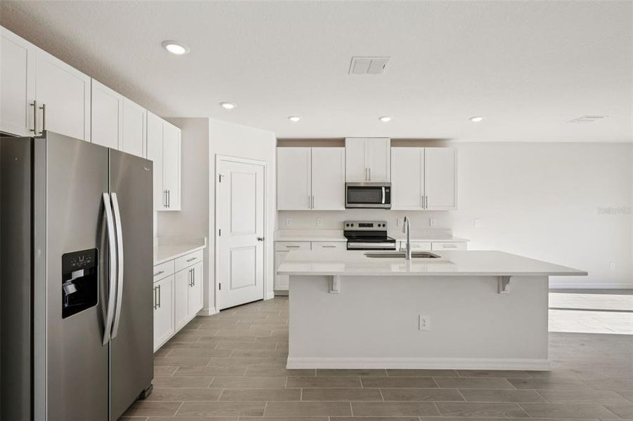 Furnished interior view inside a new home in The Grove at Stuart Crossing - Classic Series, Bartow (Image 6).