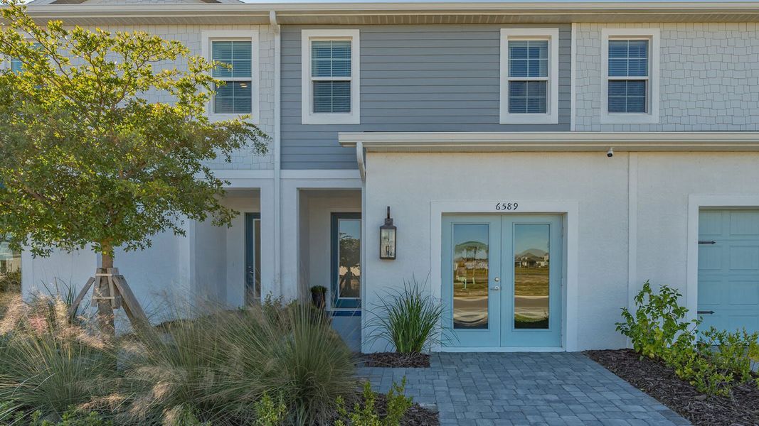 Exterior details and patio area of a home in Grand Park Real Estate and Homes for Sale in Sarasota, FL - Neal Communities, Sarasota (Image 4).