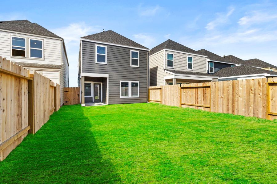 Exterior details and patio area of a home in Grand West, Houston (Image 3).