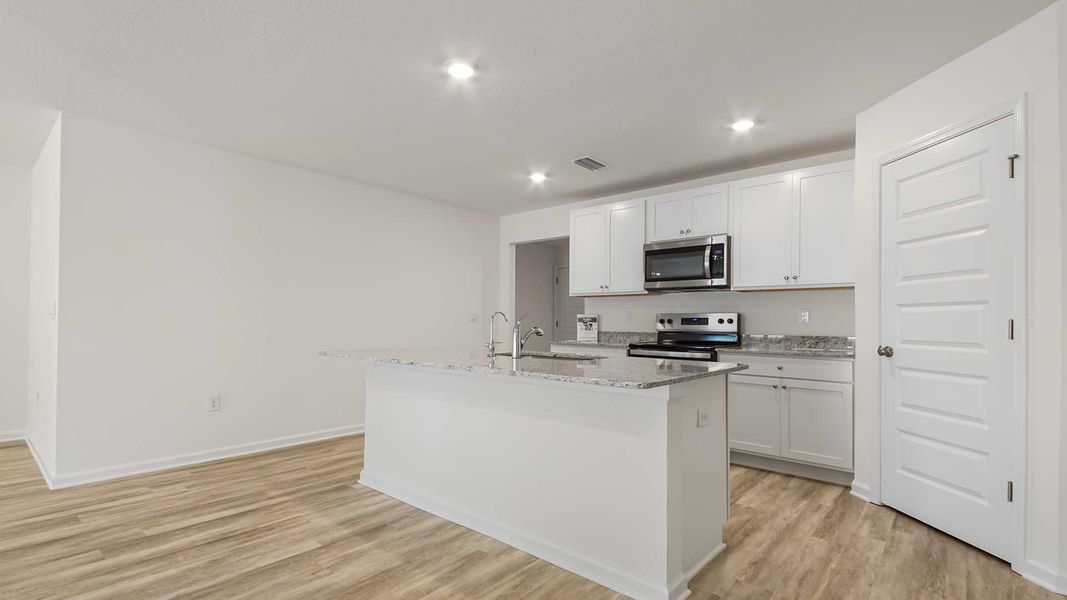 Furnished interior view inside a new home in Ashton Park Phase III, Freeport (Image 8).