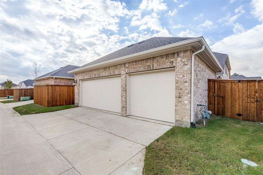 Front exterior of a new home in Cambridge Crossing, Celina, TX, highlighting curb appeal (Image 2).